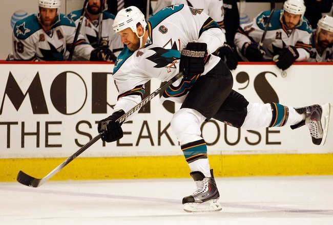 CHICAGO - MAY 21:  Rob Blake #4 of the San Jose Sharks slaps the puck while taking on the Chicago Blackhawks in Game Three of the Western Conference Finals during the 2010 NHL Stanley Cup Playoffs at the United Center on May 21, 2010 in Chicago, Illinois.