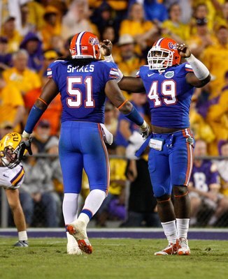 BATON ROUGE, LA - OCTOBER 10:  Jermaine Cunningham #49 and Brandon Spikes #51 of the Florida Gators against the Louisiana State University Tigers at Tiger Stadium on October 10, 2009 in Baton Rouge, Louisiana.  (Photo by Kevin C. Cox/Getty Images)