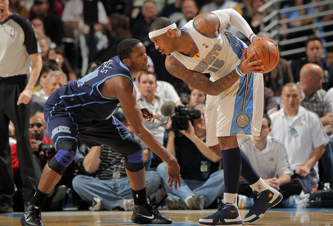 DENVER - APRIL 28:  Carmelo Anthony #15 of the Denver Nuggets as C.J. Miles #34 of the Utah Jazz defends in Game Five of the Western Conference Quarterfinals of the 2010 NBA Playoffs at the Pepsi Center on April 28, 2010 in Denver, Colorado. The Nuggets d