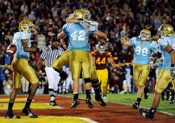 LOS ANGELES, CA - NOVEMBER 28:  Chane Moline #42 of the UCLA Bruins celebrates his touchdown against USC Trojans during the fourth quarter of the NCAA college football game at Los Angeles Memorial Coliseum on November 28, 2009 in Los Angeles, California. 