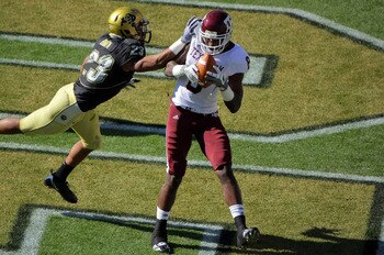 BOULDER, CO - NOVEMBER 07:  Jeff Fuller #8 of the Texas A&M Aggies catches a one yard touchdown pass against the defense of Jalil Brown #23 of the Colorado Buffaloes for the first score of the game in the first quarter during NCAA college football action