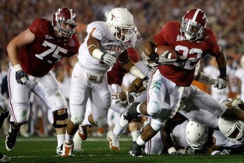 PASADENA, CA - JANUARY 07:  Running back Mark Ingram #22 of the Alabama Crimson Tide runs with the ball as Keenan Robinson #1 of the Texas Longhorns tries to tackle during the Citi BCS National Championship game at the Rose Bowl on January 7, 2010 in Pasa