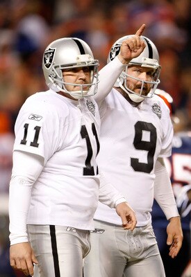 DENVER - DECEMBER 20:  Sebastian Janikowski #11 and Shane Lechler #9 of the Oakland Raiders celebrate the extra point after Chaz Schilens' touchdown in the fourth quarter against the Denver Broncos at Invesco Field at Mile High on December 20, 2009 in Den