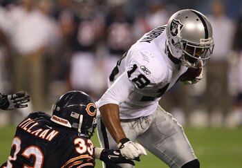 CHICAGO - AUGUST 21: Louis Murphy #18 of the Oakland Raiders runs for yardage as Charles Tillman #33 of the Chicago Bears closes in during a preseason game at Soldier Field on August 21, 2010 in Chicago, Illinois. The Raiders defeated the Bears 32-17. (Ph