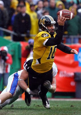 KANSAS CITY, MO - NOVEMBER 29:  Quarterback Chase Daniel #10 of the Missouri Tigers is sacked in the end-zone for a sefety by Jake Laptad #91 of the Kansas Jayhawks during the game on November 29, 2008 at Arrowhead Stadium in Kansas City, Missouri.  (Phot