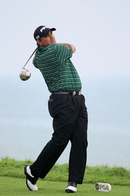 KOHLER, WI - AUGUST 13:  Angel Cabrera of Argentina hits his tee shot on the 16th hole during the continuation of the first round of the 92nd PGA Championship on the Straits Course at Whistling Straits on August 13, 2010 in Kohler, Wisconsin.  (Photo by A