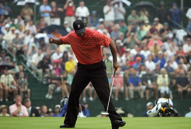 MEDINAH, IL - AUGUST 18:  Tiger Woods pumps his fist after sinking a birdie putt on the 18th hole during the second round of the 2006 PGA Championship at Medinah Country Club on August 18, 2006 in Medinah, Illinois.  (Photo by Jeff Gross/Getty Images)