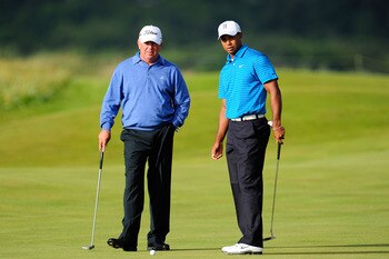 ST ANDREWS, SCOTLAND - JULY 13:  Mark O'Meara (L) and Tiger Woods of the United States practice putting during practice for the 139th Open Championship on the Old Course, St Andrews on July 13, 2010 in St Andrews, Scotland.  (Photo by Stuart Franklin/Gett