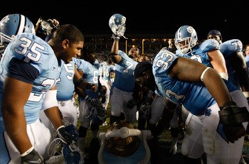 CHAPEL HILL, NC - NOVEMBER 07:  The North Carolina Tar Heels celebrate by ringing the bell after a 19-6 victory over the Duke Blue Devils during their game at Kenan Stadium on November 7, 2009 in Chapel Hill, North Carolina.  (Photo by Streeter Lecka/Gett