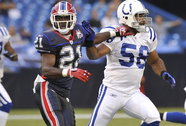 TORONTO, CANADA - AUGUST 19: C.J. Spiller #21 of the Buffalo Bills runs with Gary Brackett #58 of the Indianapolis Colts during game action August 19, 2010 at the Rogers Centre in Toronto, Ontario, Canada. (Photo by Brad White/Getty Images)