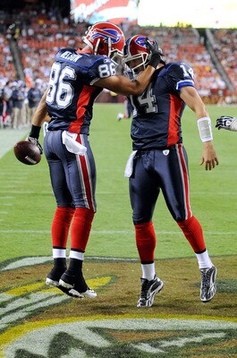 LANDOVER, MD - AUGUST 13:  David Nelson #86 celebrates with Ryan Fitzpatrick #14 of the Buffalo Bills after scoring in the third quarter of the preseason game against the Washington Redskins at FedEx Field on August 13, 2010 in Landover, Maryland.  (Photo
