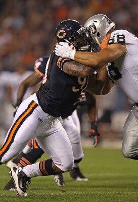 CHICAGO - AUGUST 21: Julius Peppers #90 of the Chicago Bears rushes against Jared Veldheer #68 of the Oakland Raiders during a preseason game at Soldier Field on August 21, 2010 in Chicago, Illinois. The Radiers defeated the Bears 32-17. (Photo by Jonatha