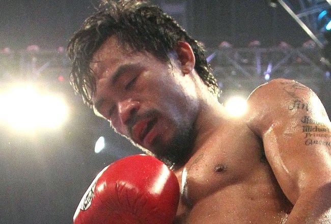 ARLINGTON, TX - MARCH 13:  Manny Pacquiao of the Philippines looks on in the ring against Joshua Clottey of Ghana during the WBO welterweight title fight at Cowboys Stadium on March 13, 2010 in Arlington, Texas. Pacquiao defeated Clottey by unanimous deci