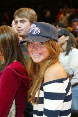 NEW YORK - APRIL 25:  Actress Lindsay Lohan sits courtside during Game four of the Eastern Conference Quarterfinals of the 2004 NBA Playoffs between the New York Knicks and the New Jersey Nets on April 25, 2004 at Madison Square Garden in New York City. T