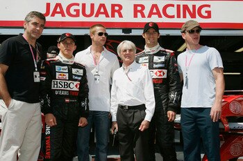 MONTE CARLO, MONACO -  MAY 22:  (l to r) George Clooney, Christian Klien, Brad Pitt, Bernie Ecclestone, Mark Webber, Matt Damon pose outside the Jaguar garage as the official guests of Jaguar Racing for a photo-call to promote the forthcomimg film Oceans