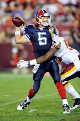 LANDOVER, MD - AUGUST 13:  Trent Edwards #5 of the Buffalo Bills is hit during the preseason game by Perry Riley #53 of the Washington Redskins at FedEx Field on August 13, 2010 in Landover, Maryland.  (Photo by Greg Fiume/Getty Images)