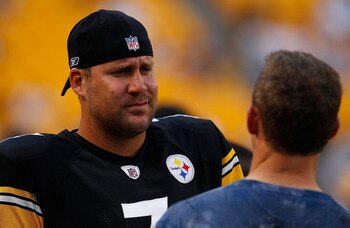 PITTSBURGH - AUGUST 14:  Ben Roethlisberger #7 of the Pittsburgh Steelers jokes around prior to the game with former Steeler Merril Hoge against the Detroit Lions on August 14, 2010 at Heinz Field in Pittsburgh, Pennsylvania. Steelers won 23-7.  (Photo by