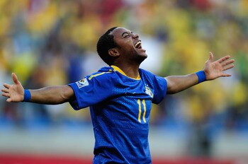 PORT ELIZABETH, SOUTH AFRICA - JULY 02:  Robinho of Brazil celebrates scoring the opening goal during the 2010 FIFA World Cup South Africa Quarter Final match between Netherlands and Brazil at Nelson Mandela Bay Stadium on July 2, 2010 in Nelson Mandela B