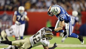 MIAMI GARDENS, FL - FEBRUARY 07:  Austin Collie #17 of the Indianapolis Colts is hit by Darren Sharper #42 of the New Orleans Saints during Super Bowl XLIV on February 7, 2010 at Sun Life Stadium in Miami Gardens, Florida.  (Photo by Andy Lyons/Getty Imag
