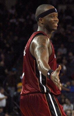 OAKLAND, CA - JANUARY 13:  Jermaine O'Neal #7 of the Miami Heat celebrates with teammate Dwyane Wade #3  during an NBA game against the Golden State Warriors at Oracle Arena on January 13, 2010 in Oakland, California.  NOTE TO USER: User expressly acknowl