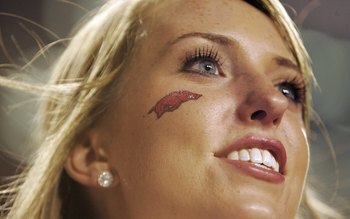 FAYETTEVILLE, AR - SEPTEMBER 02:  An Arkansas Razorbacks' cheerleader watches a game against the University of Southern California Trojans on September 2, 2006 at Donald W. Reynolds Razorback Stadium in Fayetteville, Arkansas.  The Trojans won 50-14.  (Ph