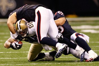 NEW ORLEANS - AUGUST 21:  Jeremy Shockey #88 of the New Orleans Saints is tackled by Connor Barwin #98 and Brian Cushing # 56 of the Houston Texans at the Louisiana Superdome on August 21, 2010 in New Orleans, Louisiana.  (Photo by Chris Graythen/Getty Im