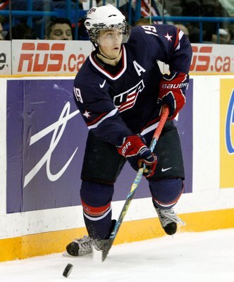 SASKATOON, SK - JANUARY 3:  Jordan Schroeder #19 of Team USA skates with the puck during the 2010 IIHF World Junior Championship Tournament Semifinal game against Team Sweden on January 3, 2010 at the Credit Union Centre in Saskatoon, Saskatchewan, Canada