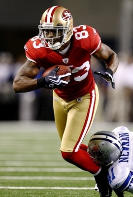 DALLAS - AUGUST 29:  Arnaz Battle #83 of the San Francisco 49ers rushes under pressure from Terence Newman #41 of the Dallas Cowboys during the preseason game at Cowboys Stadium on August 29, 2009 in Dallas, Texas.  (Photo by Ronald Martinez/Getty Images)