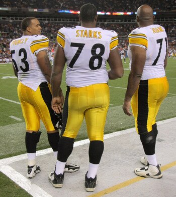 DENVER - AUGUST 29:  Offensive linemen Maurkice Pouncey #53, Max Starks #78, Flozell Adams #71 and Chris Kemoeatu #68 of the Pittsburgh Steelers watch from the sideline as they prepare for action against the Denver Broncos during preseason NFL action at I