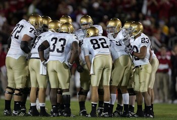 PALO ALTO, CA - NOVEMBER 28:  The Notre Dame Fighting Irish offense huddles up during their game against the Stanford Cardinal at Stanford Stadium on November 28, 2009 in Palo Alto, California.  (Photo by Ezra Shaw/Getty Images)