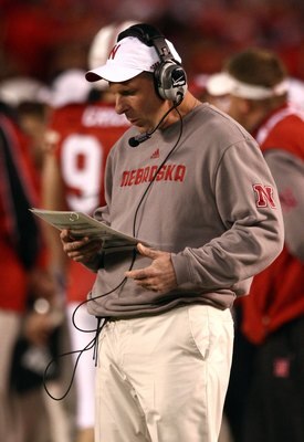 SAN DIEGO - DECEMBER 30:  Head Coach Bo Pelini of the University of Nebraska looks at his play list during the Pacific Life Holiday Bowl against University of Arizona Wildcats on December 30, 2009 at Qualcomm Stadium in San Diego, California. The Cornhusk