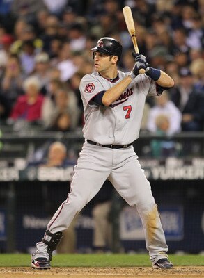 SEATTLE - AUGUST 27:  Joe Mauer #7 of the Minnesota Twins bats against the Seattle Mariners at Safeco Field on August 27, 2010 in Seattle, Washington. The Twins won 6-3. (Photo by Otto Greule Jr/Getty Images)