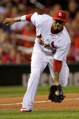 ST. LOUIS - JUNE 28:  Felipe Lopez #3 of the St. Louis Cardinals fields a ground ball against the Arizona Diamondbacks at Busch Stadium on June 28, 2010 in St. Louis, Missouri.  The Cardinals beat the Diamondbacks 6-5 in the bottom of the ninth.  (Photo b