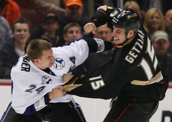 ANAHEIM, CA - JANUARY 09: Matt Pettinger #24 of the Tampa Bay Lightning fights with Ryan Getzlaf #15 of the Anaheim Ducks on January 9, 2009 at the Honda Center in Anaheim, California. (Photo by Bruce Bennett/Getty Images)