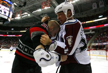 RALEIGH, NC - FEBRUARY 22:  Chris Stewart #42 of the Colorado Avalanche fights with Tim Conboy #38 of the Carolina Hurricanes during the game on February 22, 2009 at RBC Center in Raleigh, North Carolina.  (Photo by Kevin C. Cox/Getty Images)