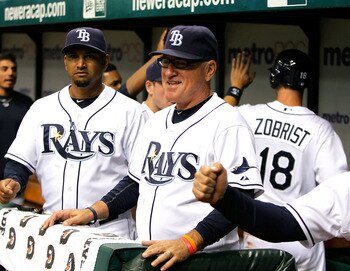ST. PETERSBURG - AUGUST 31:  Manager Joe Maddon #70 of the Tampa Bay Rays smiles after his team scored a run against the Toronto Blue Jays during the game at Tropicana Field on August 31, 2010 in St. Petersburg, Florida.  (Photo by J. Meric/Getty Images)