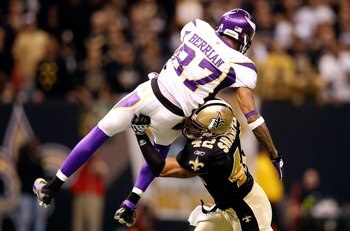 NEW ORLEANS - JANUARY 24:  Darren Sharper #42 of the New Orleans Saints hits Bernard Berrian #87 of the Minnesota Vikings during the NFC Championship Game at the Louisiana Superdome on January 24, 2010 in New Orleans, Louisiana. The Saints won 31-28.  (Ph