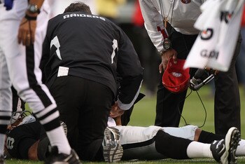 Jason Campbell on the ground after a sack by 49ers Travis LaBoy.