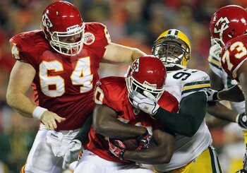 KANSAS CITY, MO - SEPTEMBER 02:  Running back Javarris Williams #40 of the Kansas City Chiefs is facemasked by Anthony Toribio #93 of the Green Bay Packers during the game on September 2, 2010 at Arrowhead Stadium in Kansas City, Missouri.  (Photo by Jami