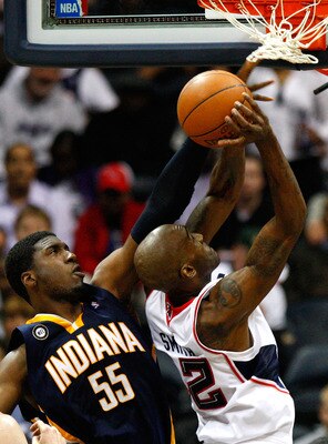 ATLANTA - OCTOBER 28:  Roy Hibbert #55 of the Indiana Pacers defends the basket against Joe Smith #32 of the Atlanta Hawks at Philips Arena on October 28, 2009 in Atlanta, Georgia.  (Photo by Kevin C. Cox/Getty Images)