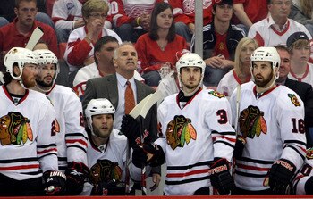 DETROIT - MAY 19:  (L-R) Martin Havlat #24, Troy Brouwer #22, Kris Versteeg #32, Head coach Joel Quennville, Dave Bolland #36 and Andrew Ladd #16 of the Chicago Blackhawks look on from the bench late in the game against the Detroit Red Wings during Game T