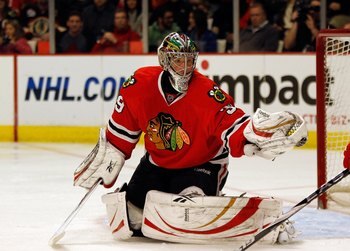 CHICAGO - MARCH 07: Christobal Huet #39 of the Chicago Blackhawks makes a glove save against the Detroit Red Wings at the United Center on March 7, 2010 in Chicago, Illinois. The Red Wings defeated the Blackhawks 5-4. (Photo by Jonathan Daniel/Getty Image