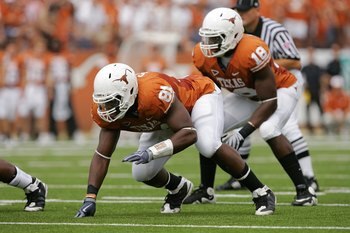 AUSTIN, TX - NOVEMBER 07:  Defensive end Sam Acho #81 and linebacker Emmanuel Acho #18 of the Texas Longhorns line up for a play against the UCF Knights on November 7, 2009 at Darrell K Royal - Texas Memorial Stadium in Austin, Texas.  Texas won 35-3.  (P