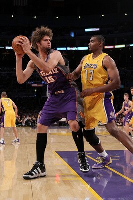 LOS ANGELES, CA - MAY 27:  Robin Lopez #15 of the Phoenix Suns looks to move the ball as Andrew Bynum #17 of the Los Angeles Lakers defends in the second quarter of Game Five of the Western Conference Finals during the 2010 NBA Playoffs at Staples Center