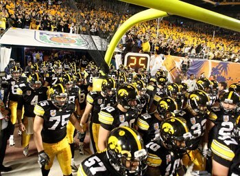 MIAMI GARDENS, FL - JANUARY 05:  The Iowa Hawkeyes take the field in front of their fans against the Georgia Tech Yellow Jackets during the FedEx Orange Bowl at Land Shark Stadium on January 5, 2010 in Miami Gardens, Florida. Iowa won 24-14. (Photo by Str