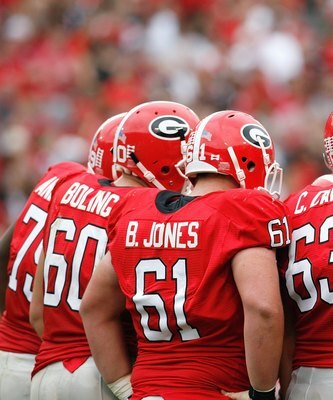 ATHENS, GA - OCTOBER 11:  Ben Jones #61, Chris Davis #63 and Vince Vance #72 of the Georgia Bulldogs huddle during the game against the Tennessee Volunteers at Sanford Stadium on October 11, 2008 in Athens, Georgia.  (Photo by Kevin C. Cox/Getty Images)
