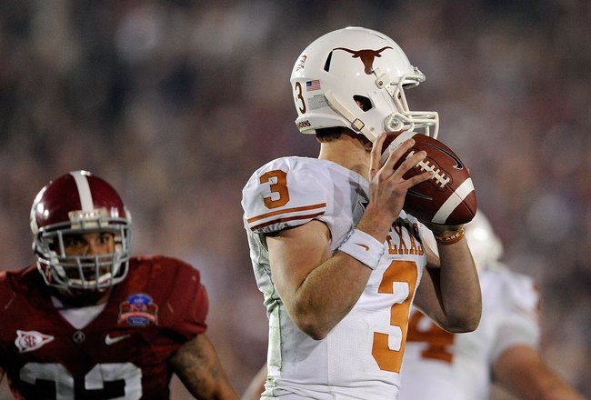 PASADENA, CA - JANUARY 07:  Quarterback Garrett Gilbert #3 of the Texas Longhorns looks to pass as linebacker Eryk Anders #32 of the Alabama Crimson Tide rushes in during the Citi BCS National Championship game at the Rose Bowl on January 7, 2010 in Pasad