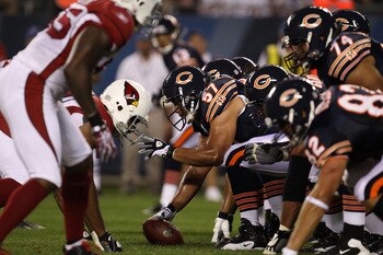 CHICAGO - AUGUST 28: Olin Kreutz #57 of the Chicago Bears waits to snap the ball against the Arizona Cardinals during a preseason game at Soldier Field on August 28, 2010 in Chicago, Illinois. The Cardinals defeated the Bears 14-9. (Photo by Jonathan Dani