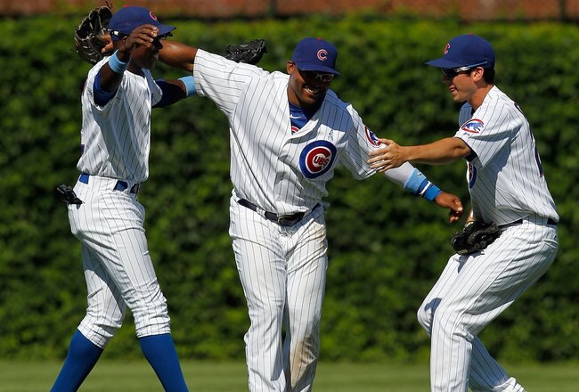 CHICAGO - JUNE 20: (L-R) Alfonso Soriano #12, Marlon Byrd #24 and Tyler Colvin #21 of the Chicago Cubs celebrate a win over the Los Angeles Angels of Anaheim at Wrigley Field on June 20, 2010 in Chicago, Illinois. The Cubs defeated the Angels 12-1. (Photo