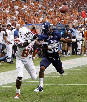 HOUSTON - SEPTEMBER 04:  Wide receiver Marquise Goodwin #84 of the Texas Longhorns can't reach the pass as he is defended by cornerback Chris Jammer #38 at Reliant Stadium on September 4, 2010 in Houston, Texas. Texas beat Rice 34-17. (Photo by Bob Levey/